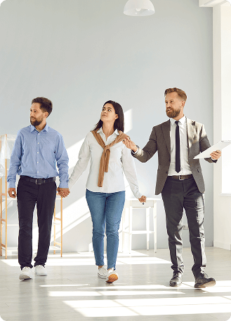 Realtor showing investment property to clients - Rivara Capital real estate financing